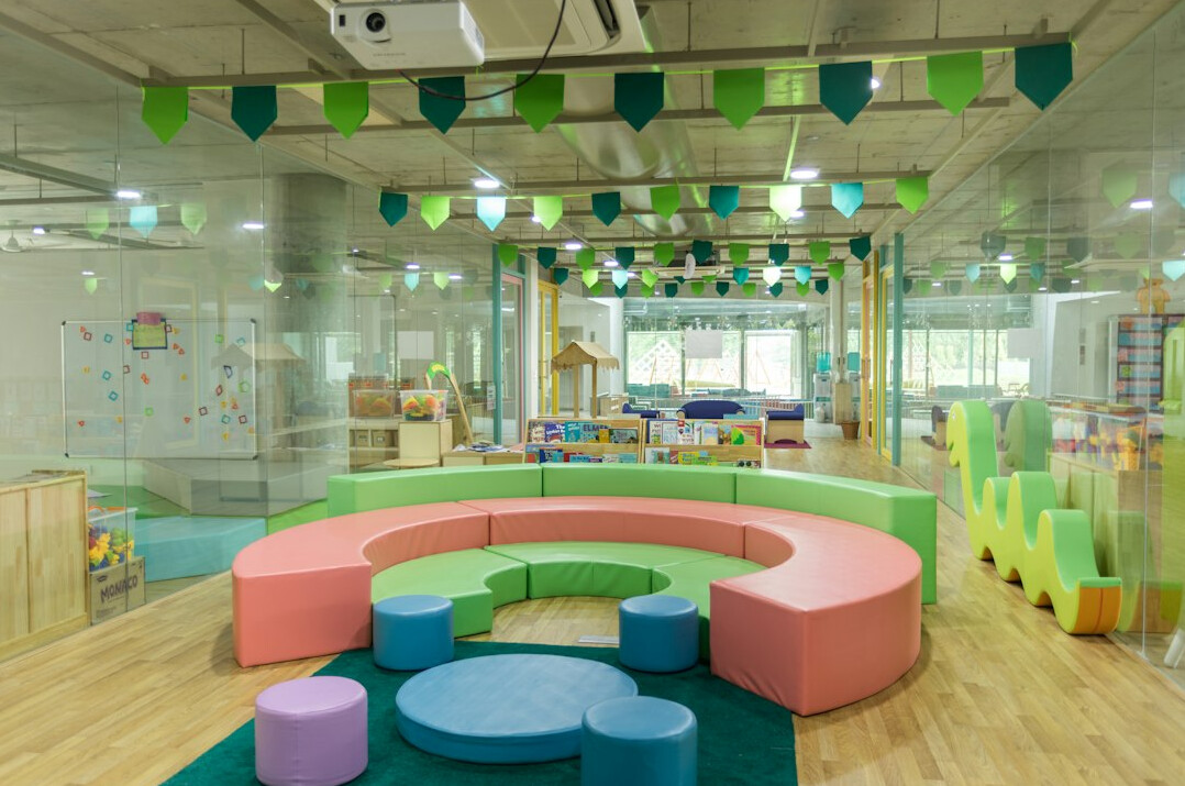 Bright modern classroom with round tables for group communication workshops